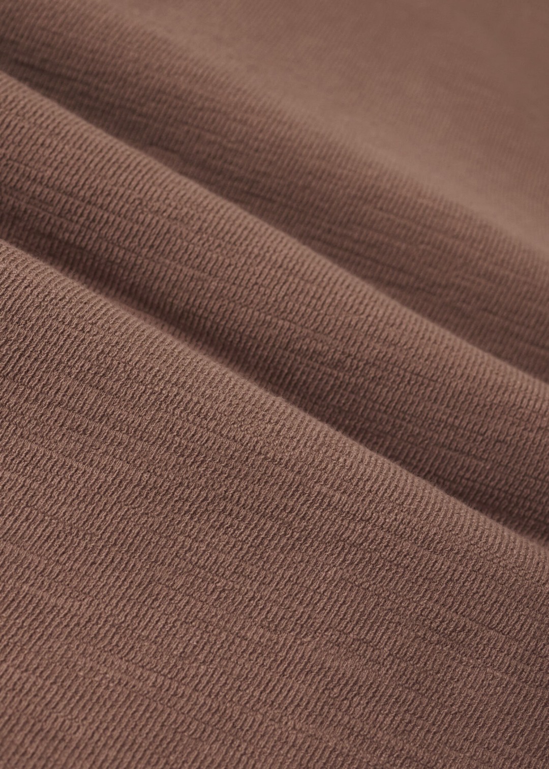 Close up of brown knit fabric