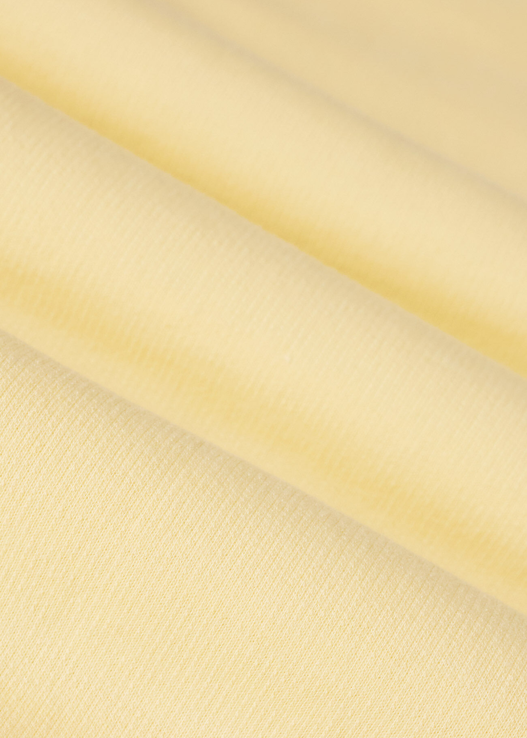 Close up of yellow knit fabric