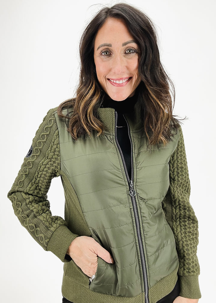 olive green jacket with cable knit sleeves and woven bodice