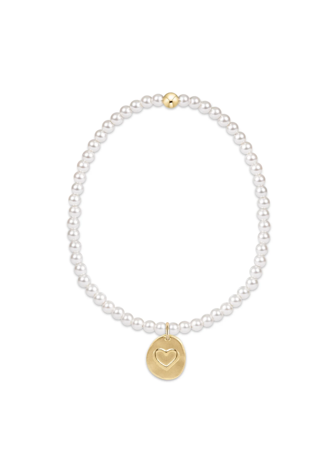 White pearl beaded bracelet with a round gold charm with a heart shape on a white background