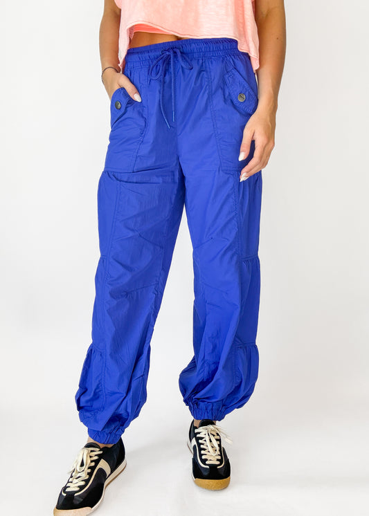 Person wearing blue pants on a white background