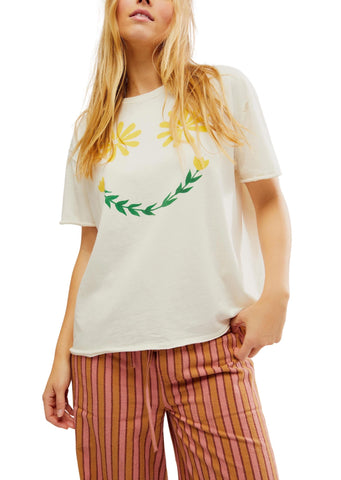 white smiley face graphic tee with flower eyes and tulip smile