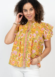 gold, pink, orange, and green floral flouncy blouse with button front, ruffle collar, and puffy ruffle sleeves