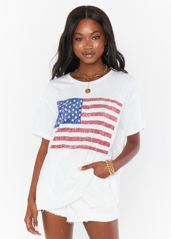 Loose fit white tee with distressed american flag vintage graphic on front