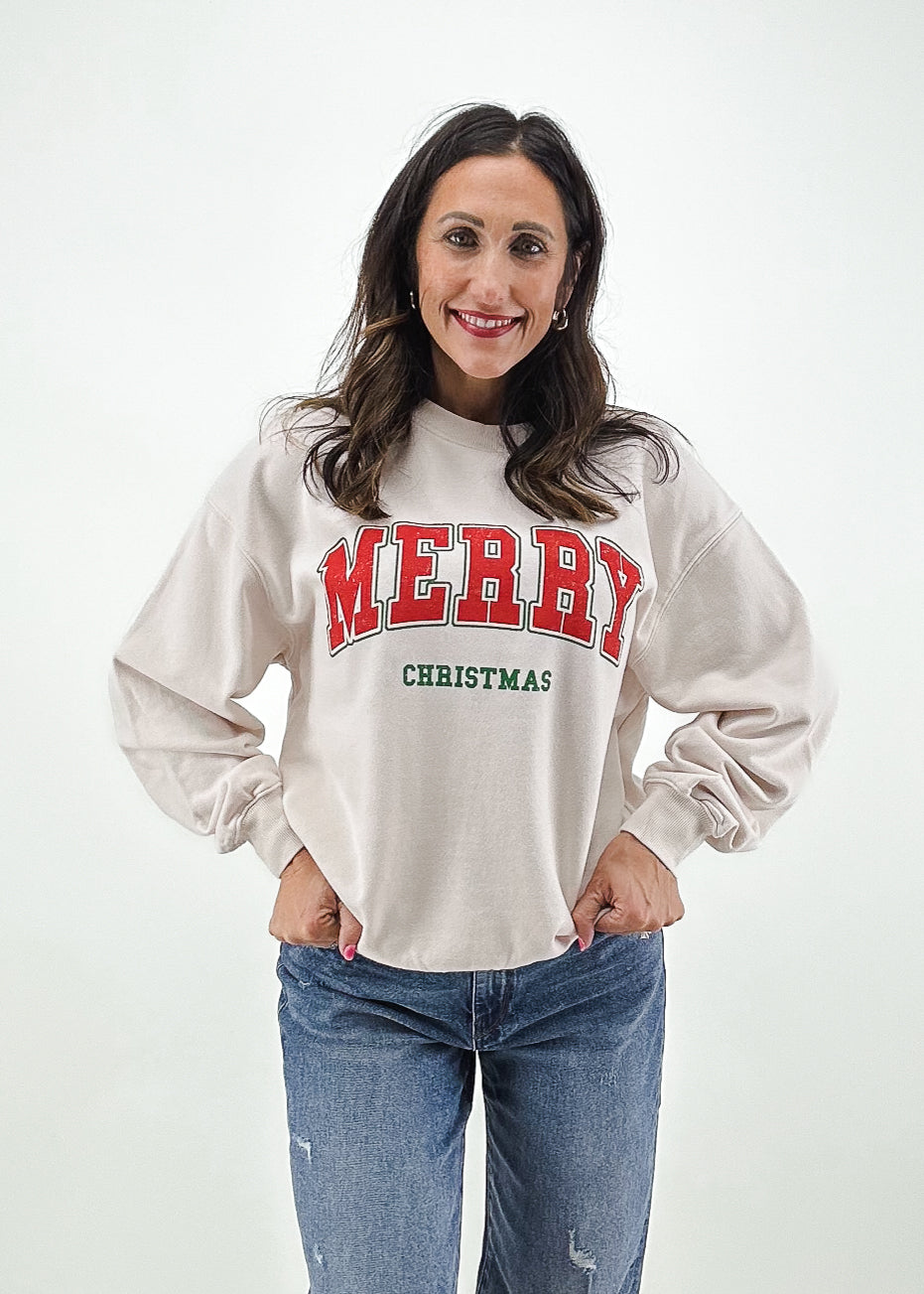 Off white oversized crew neck sweatshirt with varsity letter "Merry Christmas" red and green graphic on chest