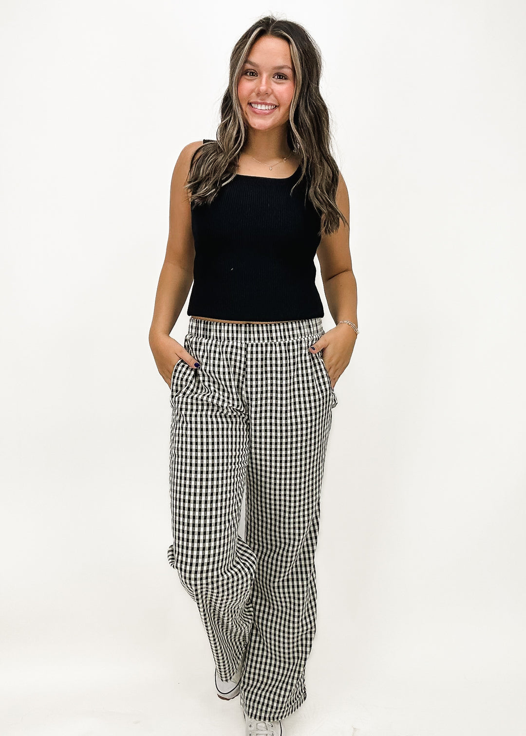 black and white gingham wide leg pants with elastic waistband styled with black square neck tank top