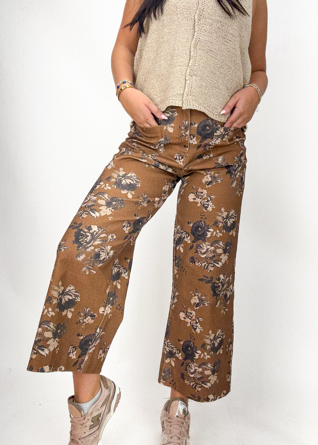 Person wearing brown floral pants 