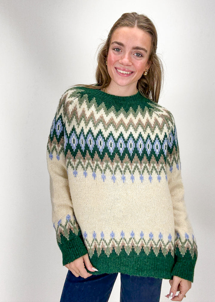 Woman wearing a patterned sweater 