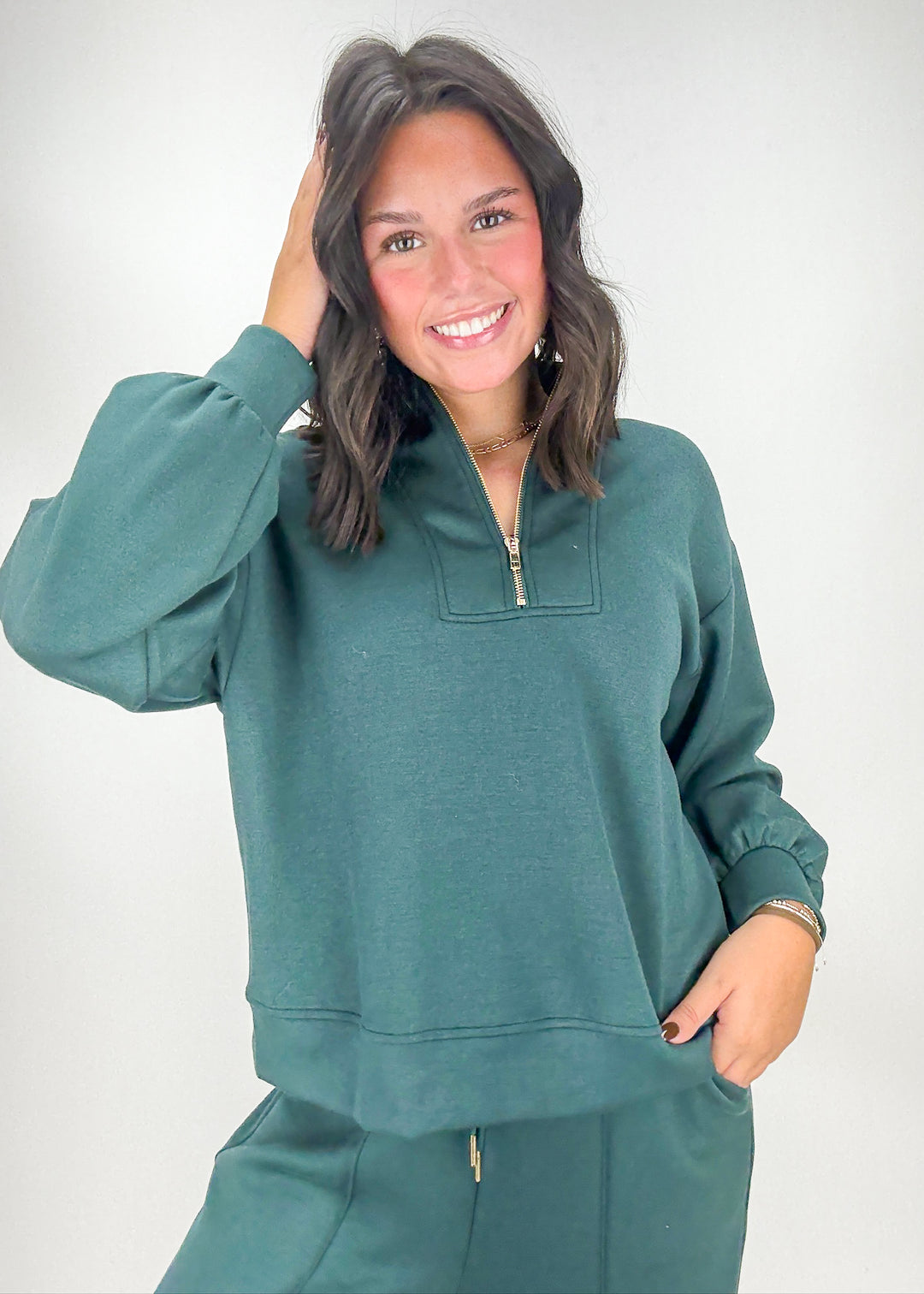 Woman wearing a teal tracksuit 