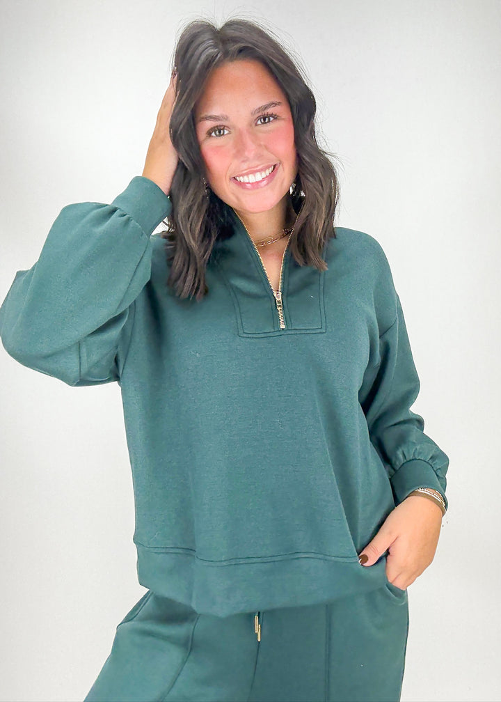 Woman wearing a teal tracksuit 