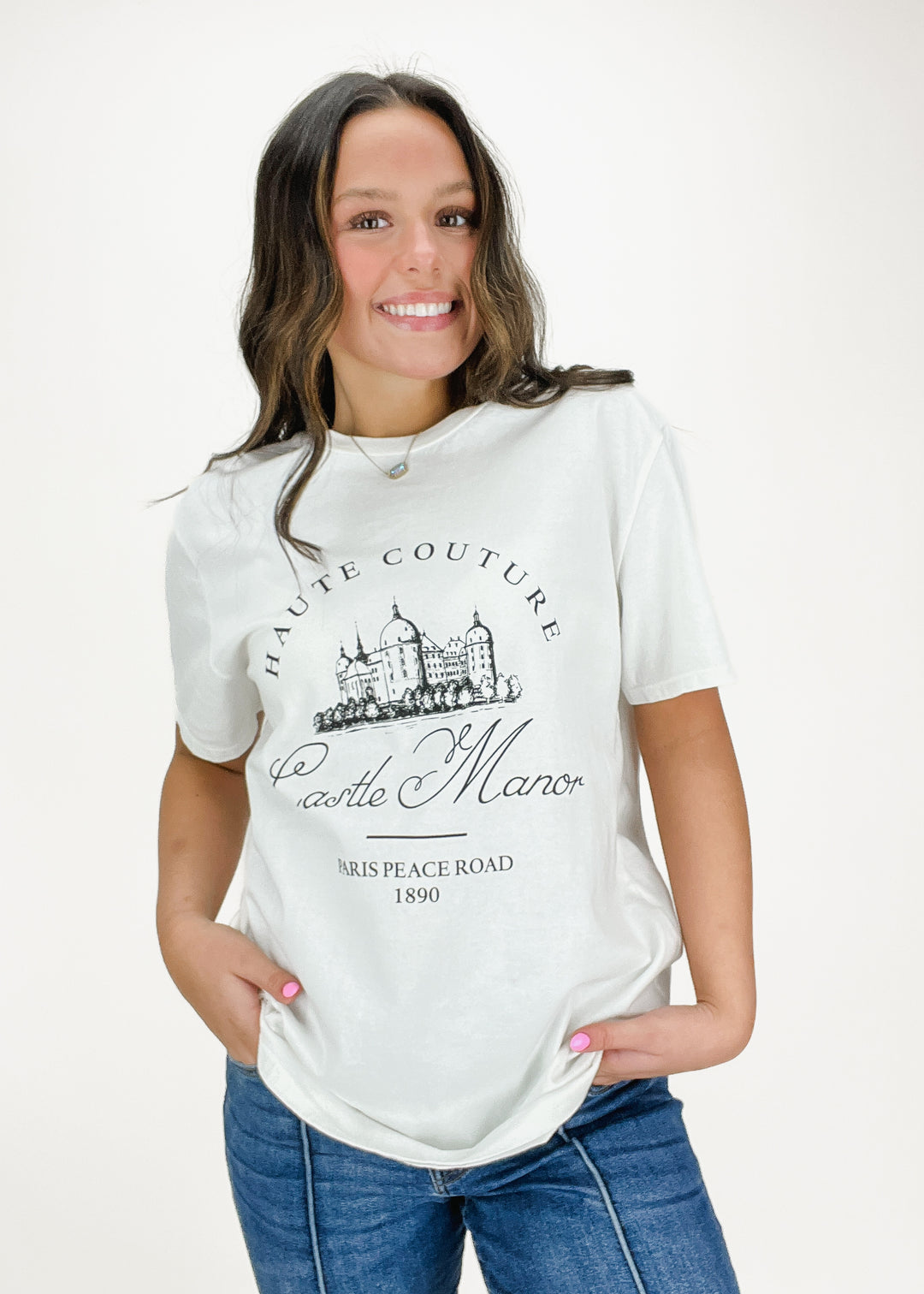 White tee with black "Castle Manor" Paris button down on chest