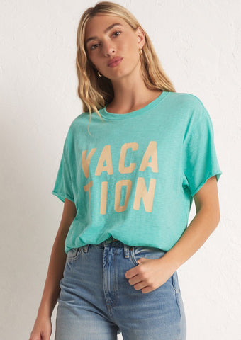 bright green oversized short sleeve tee with "vacation" written in peach block letters